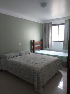 Säng eller sängar i ett rum på Casa Vilas do Atlântico, 3 quartos próximo a praia