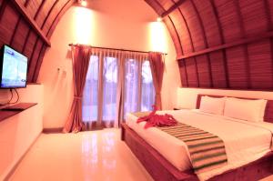 Postel nebo postele na pokoji v ubytování Uma Manyar Sunset Villa + 37 fotografií