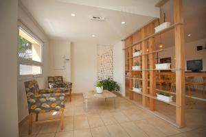 a living room with a couch and a chair at Huemul in Neuquén