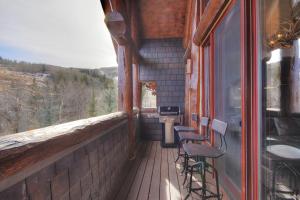 a porch of a building with chairs on it at Stunning 4 bedroom condo Snowcloud base of Bachelor Gulch condo in Avon