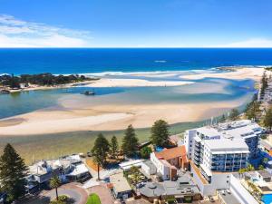 an aerial view of a beach and the ocean at The Entrance Waterfront Apartment 621 in The Entrance +4 photos