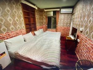 Ein Bett oder Betten in einem Zimmer der Unterkunft 福緣白龍宮海景