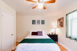 a bedroom with a bed and a ceiling fan at Ski Utah - Work, Play, Relax - Cozy in Salt Lake City