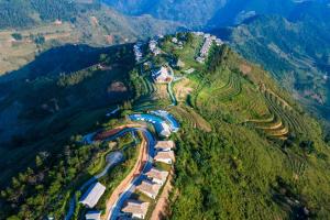 an aerial view of a mountain with a train at Topas Ecolodge in Sapa