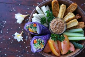 a bowl filled with different types of food at Udara Bali Yoga Detox & Spa in Canggu