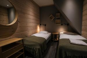 Postel nebo postele na pokoji v ubytování Levi Black Apartments