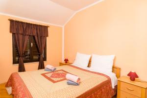 Postel nebo postele na pokoji v ubytování Apartment Amela + 19 fotografií