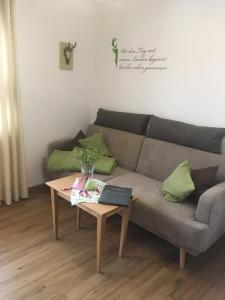 a living room with a couch and a coffee table at Haus Seidl in Bodenmais