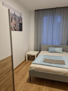 Een bed of bedden in een kamer bij Apartment Caracalla