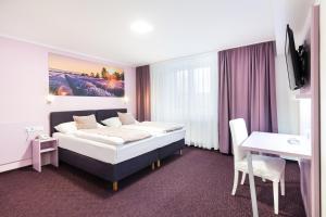 En eller flere senger på et rom på Hotel Atlantis