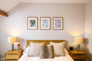 A bed or beds in a room at The Belfry Whitby 