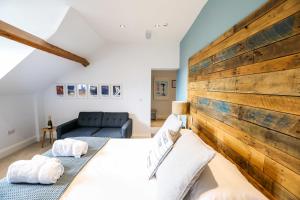 A bed or beds in a room at The Belfry Whitby 