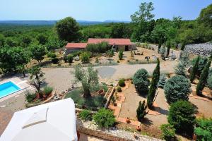 an aerial view of a garden with trees and a house at Villa Garica in Garica