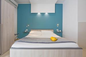 Postel nebo postele na pokoji v ubytování San Giorgio Palace Hotel Ragusa Ibla