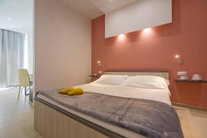 Postel nebo postele na pokoji v ubytování San Giorgio Palace Hotel Ragusa Ibla