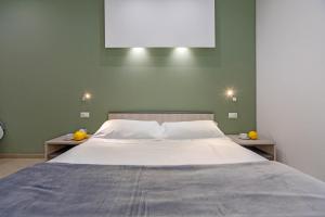 Postel nebo postele na pokoji v ubytování San Giorgio Palace Hotel Ragusa Ibla