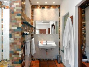 a bathroom with a sink and a mirror at La Roche Estate in Franschhoek +87 photos