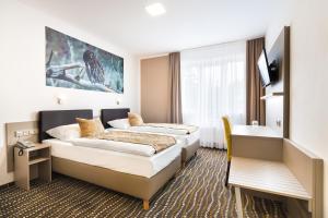 En eller flere senger på et rom på Hotel Atlantis
