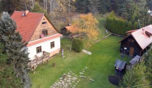 an aerial view of a house with a yard at Chata Horáreň in Smižany