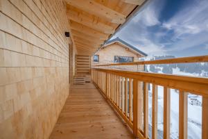 a view of the balcony of a wooden house at Naturhaus am Arlberg in Warth am Arlberg