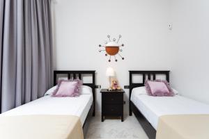 Łóżko lub łóżka w pokoju w obiekcie Maravillosa Villa de Lujo con Piscina Privada