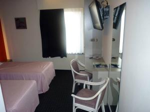 Postel nebo postele na pokoji v ubytování Hotel De Swaen