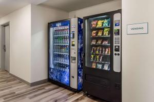a vending machine in a room with drinks at WoodSpring Suites Tacoma - Lakewood in Lakewood