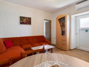 a living room with a couch and a table at Top view in Opatija