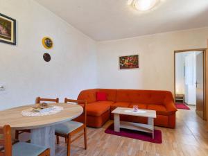 een woonkamer met een bank en een tafel bij Top view in Opatija