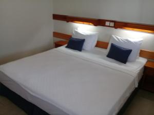 A bed or beds in a room at UzHan Beach Hotel