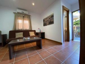 Posedenie v ubytovaní Apartamento con doble entrada y piscina compartida
