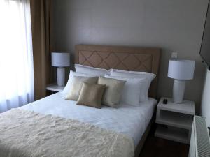 Postel nebo postele na pokoji v ubytování Luxury Villa Reina
