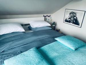 Een bed of bedden in een kamer bij B&B Huize Van Damme
