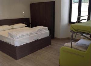 Postel nebo postele na pokoji v ubytování Antica Campione Rooms & Hostel