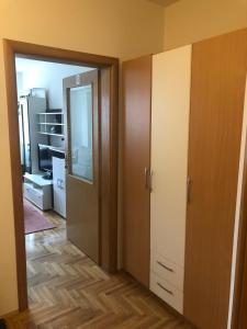 an open door to a room with a closet at Tulipan in Sombor
