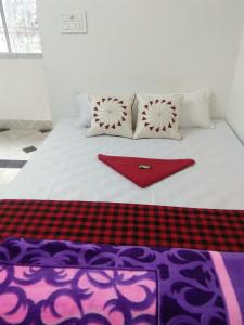 Postel nebo postele na pokoji v ubytování Sukun Guest House
