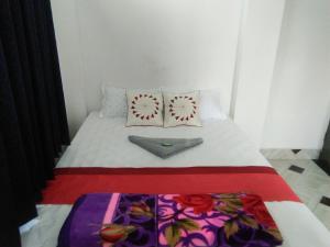 Postel nebo postele na pokoji v ubytování Sukun Guest House