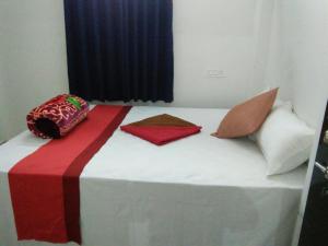 Postel nebo postele na pokoji v ubytování Sukun Guest House