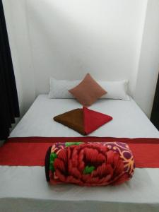 Postel nebo postele na pokoji v ubytování Sukun Guest House