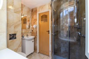 a bathroom with a shower and a toilet and a sink at Gospoda i Noclegi Na szlaku in Kudowa-Zdrój +25 photos