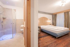 Postel nebo postele na pokoji v ubytování Hotel Foresta