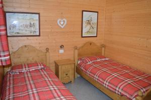 Giường trong phòng chung tại BAITA SIBERIA