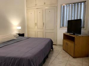 Cama ou camas em um quarto em Palace Hotel Mendoza