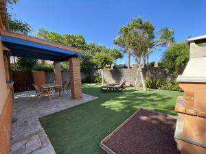 Zahrada ubytování Casita con jardín privado y piscina compartida