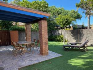 Zahrada ubytování Casita con jardín privado y piscina compartida