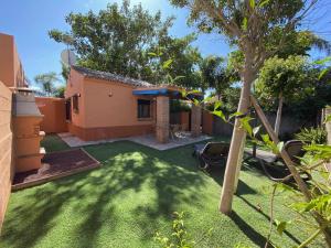 Zahrada ubytování Casita con jardín privado y piscina compartida