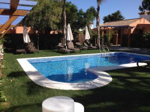Bazén v ubytování Casita con jardín privado y piscina compartida nebo v jeho okolí