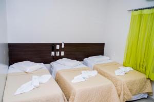 Tempat tidur dalam kamar di Hamara Soft Hotel 2