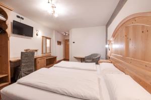 Postel nebo postele na pokoji v ubytování Hotel Foresta