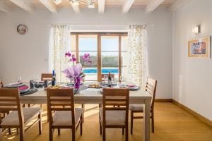 a dining room with a large table and chairs at Villa Kanco - managed by Travel Istria in Barban